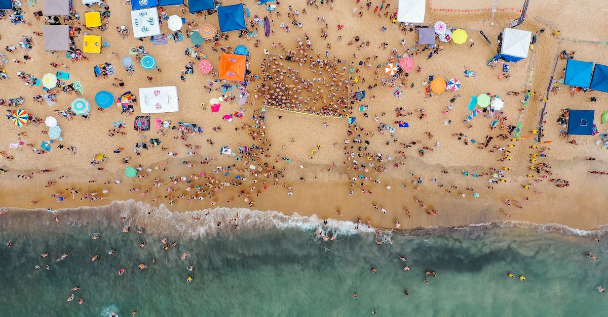 Are there any functions of collecting Lums when doing race challenges? - Crowded ocean seashore from drone