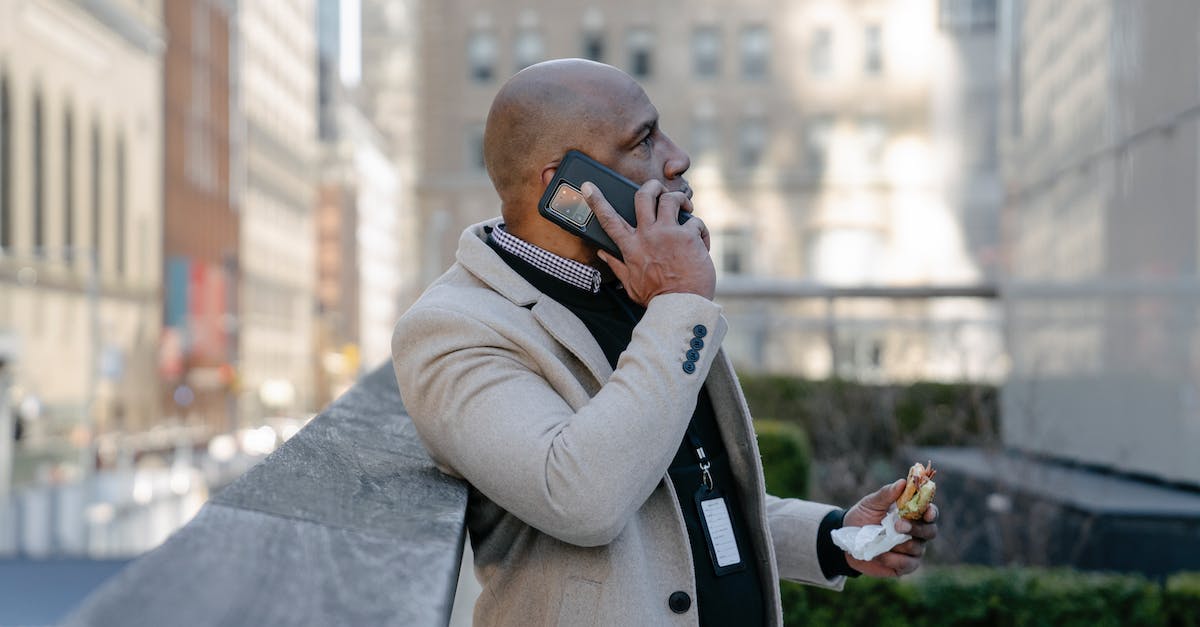 Are there any Minecraft username generators for available names? - Man in White Jacket Talking on the Phone with a Sandwich in Hand 