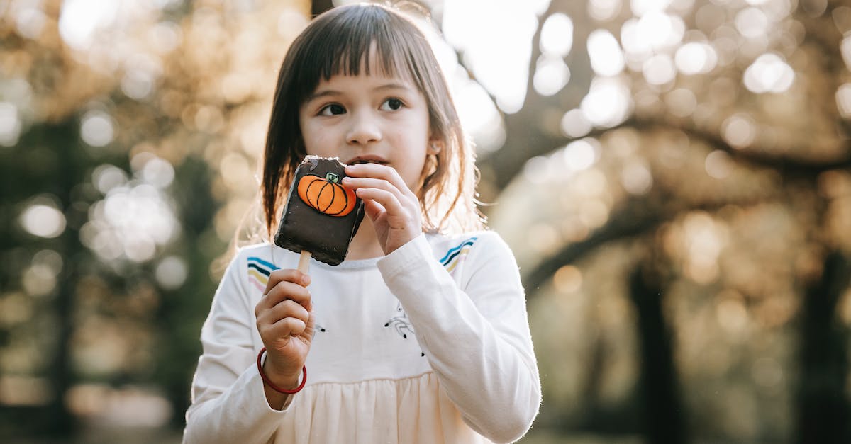 Are there any recurring South Park characters who do not appear in Stick of Truth? - Adorable little girl in white clothes standing in park with bitten tasty chocolate Halloween sweet on stick and looking away