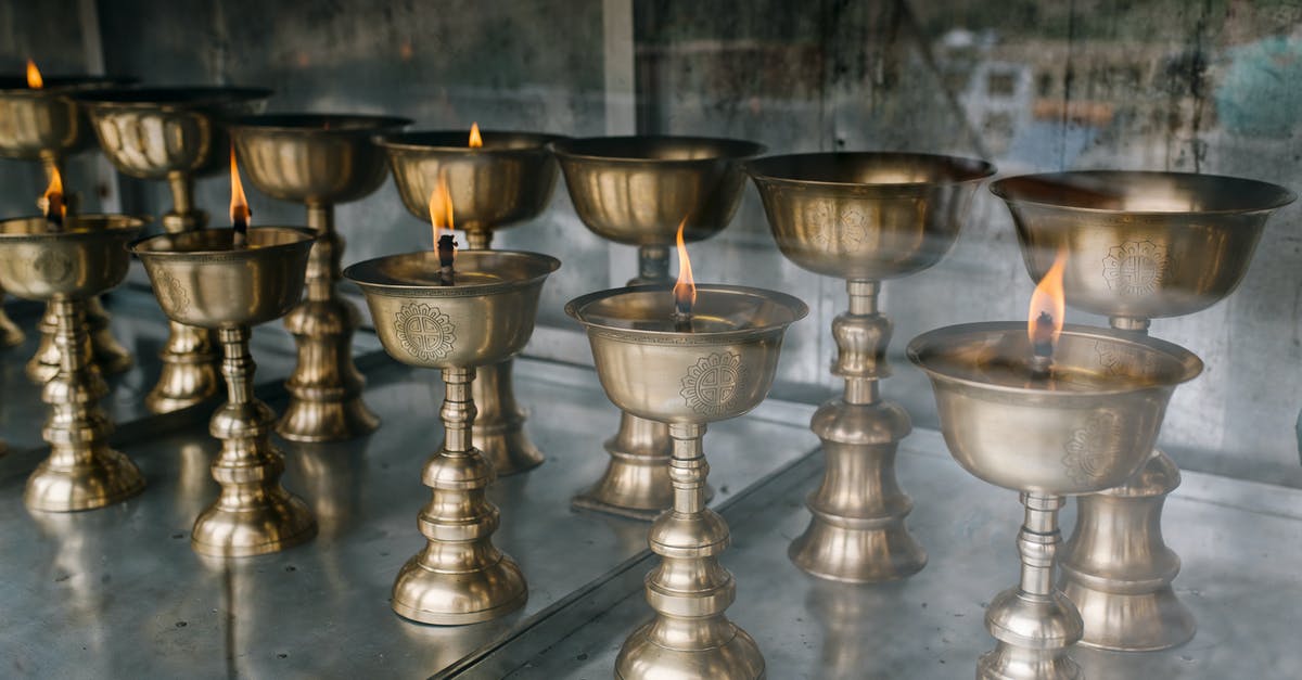 Are there any sure-fire ways to beat Round 100 on Deflation mode? - Buddhist lamps with burning candles in old church