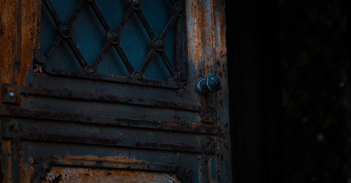 Are there methods to make an Iron Door open through right clicking while holding a specific item? [duplicate] - Low angle of opened shabby metal door of derelict damaged worn out house