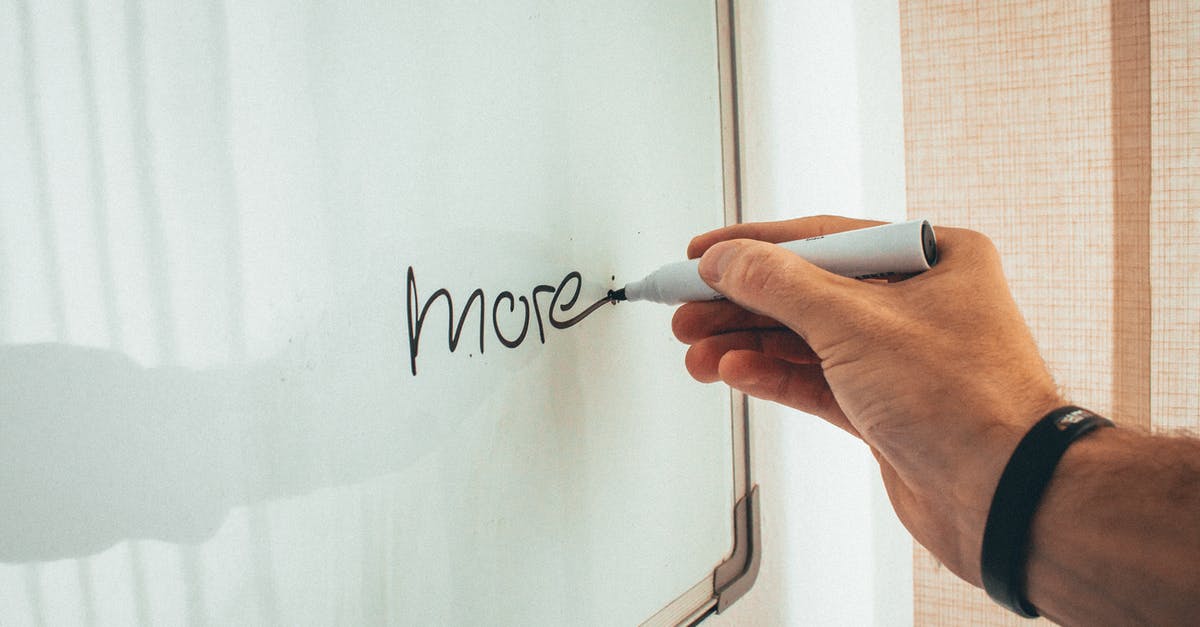 Are there more biters in multiplayer? - Crop unrecognizable man writing more word with marker on whiteboard during creating new startup in light workplace