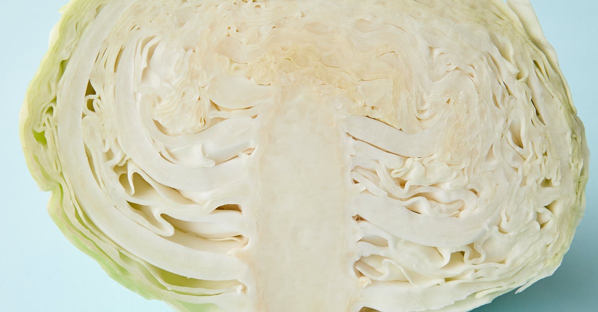 Are there two different cut scenes for every operation head you take out? - Half of fresh juicy cabbage on blue surface