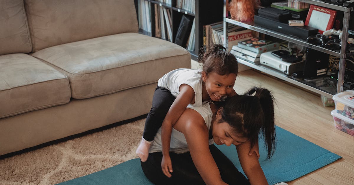 Are trained abilities passed to offspring via breeding? [duplicate] - Funny kid lying on mothers back stretching body at home