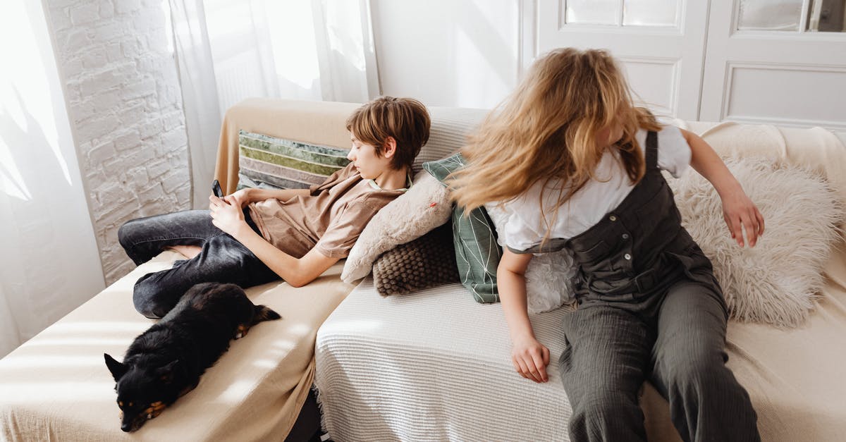 Are Waluigi and Wario brothers? - Woman in Gray Shirt Sitting on Bed Beside Woman in Gray Shirt