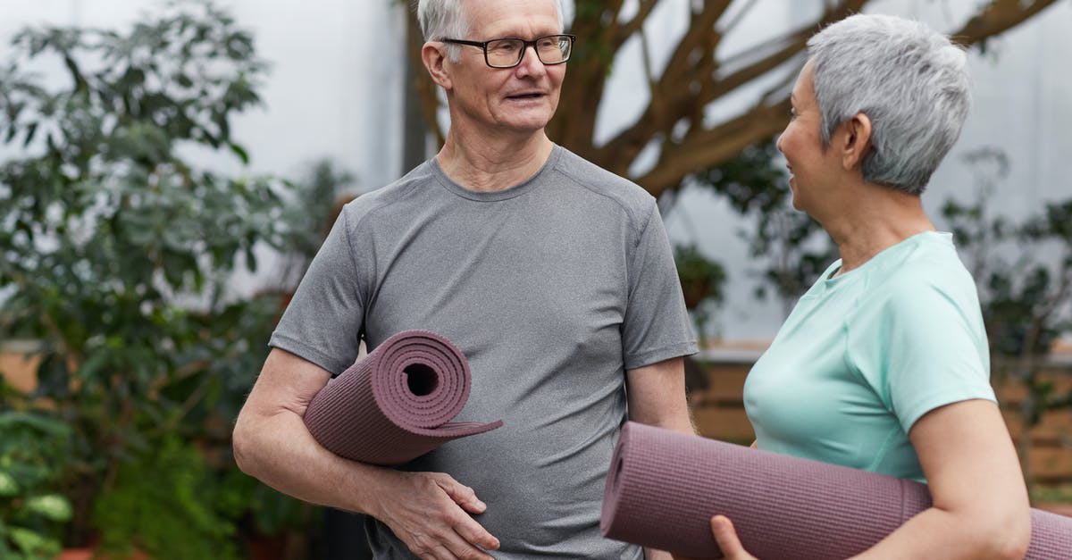 Are you Dragonborn in any Elder Scrolls Games other than Skyrim? - Couple Holding Yoga Mats While Looking at Each Other