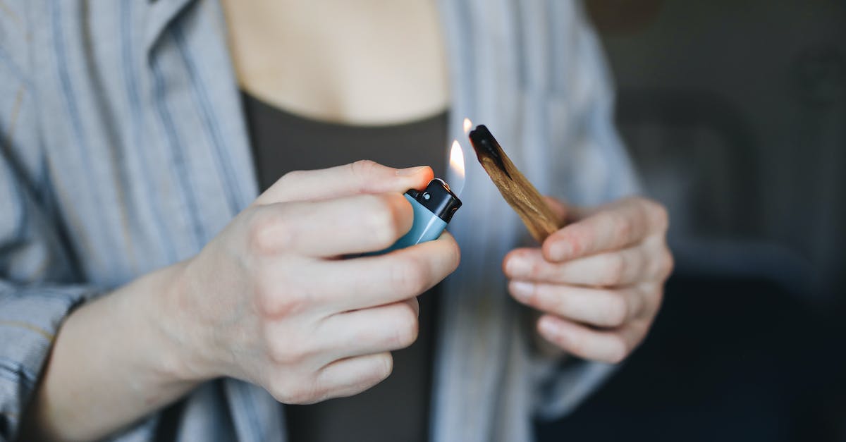 As Arsonist, how do I prevent lighting myself on fire if another Arsonist doused me? - A Person Lighting a Palo Santo with a Lighter As Arsonist, how do I prevent lighting myself on fire if another Arsonist doused me? - A Person Lighting a Palo Santo with a Lighter