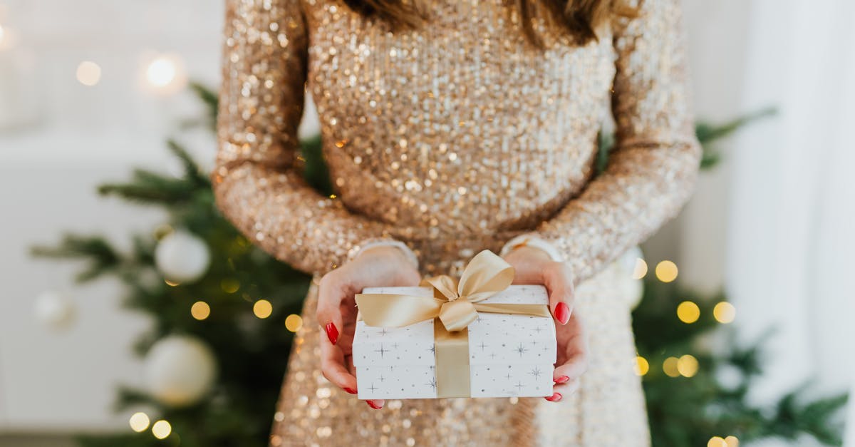 Asking for a gift - Woman in White Long Sleeve Shirt Holding White and Pink Floral Gift Box