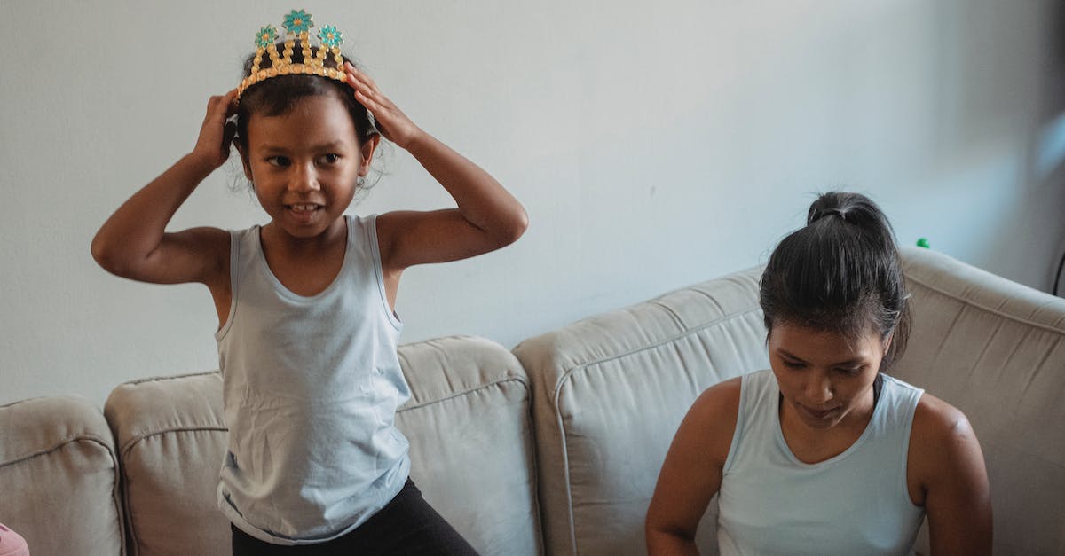 At the beginning of The Princess Bride, what game is being played? - Smiling daughter wearing crown on sofa while mother sitting in living room At the beginning of The Princess Bride, what game is being played? - Smiling daughter wearing crown on sofa while mother sitting in living room