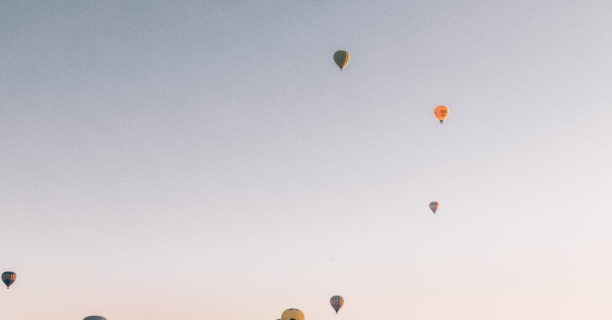 At what range do various weapons get range bonuses? - Low angel of various colorful air balloons flying in cloudless sunset sky over rocky mountains