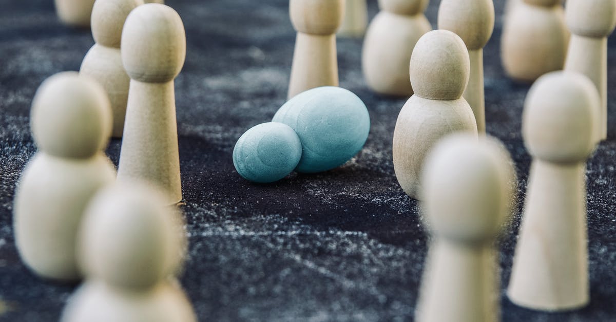 Attacking with no mouse? - Wooden figures placed among fallen representing concept of breakdown during fight against public opinion and social order