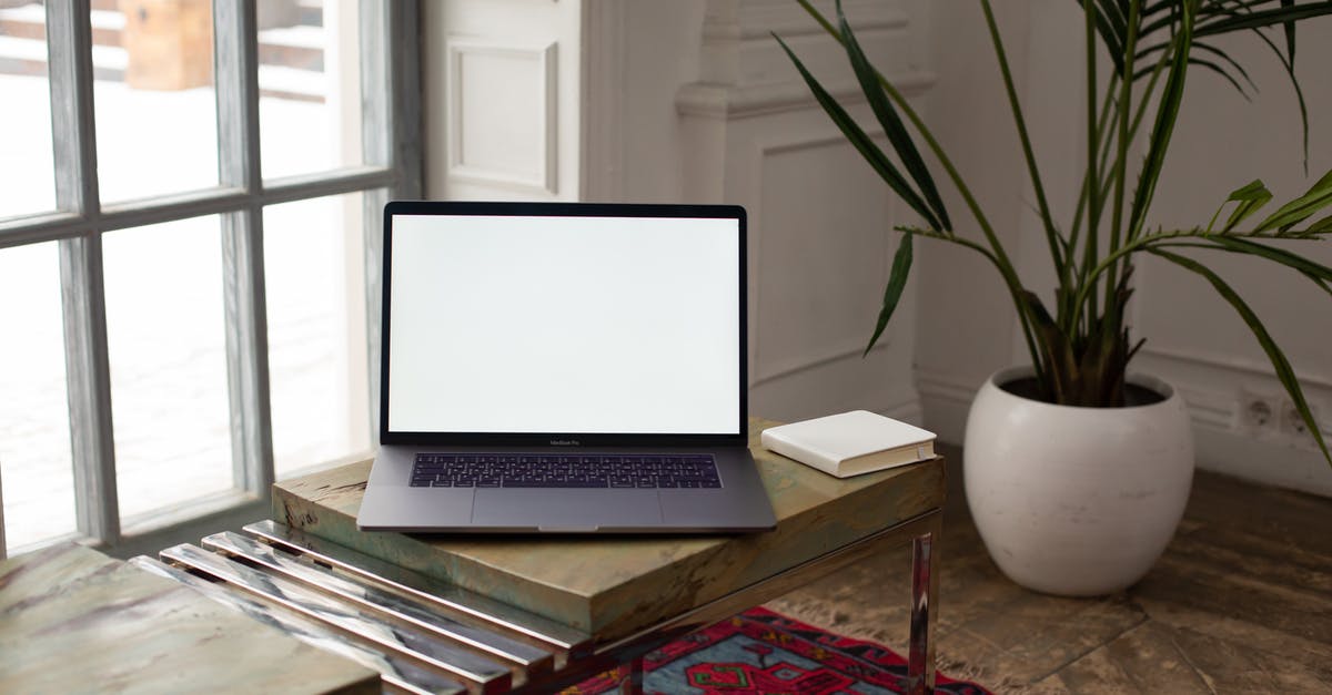 Autocrafting table in minecraft - Macbook Pro on Brown Wooden Table