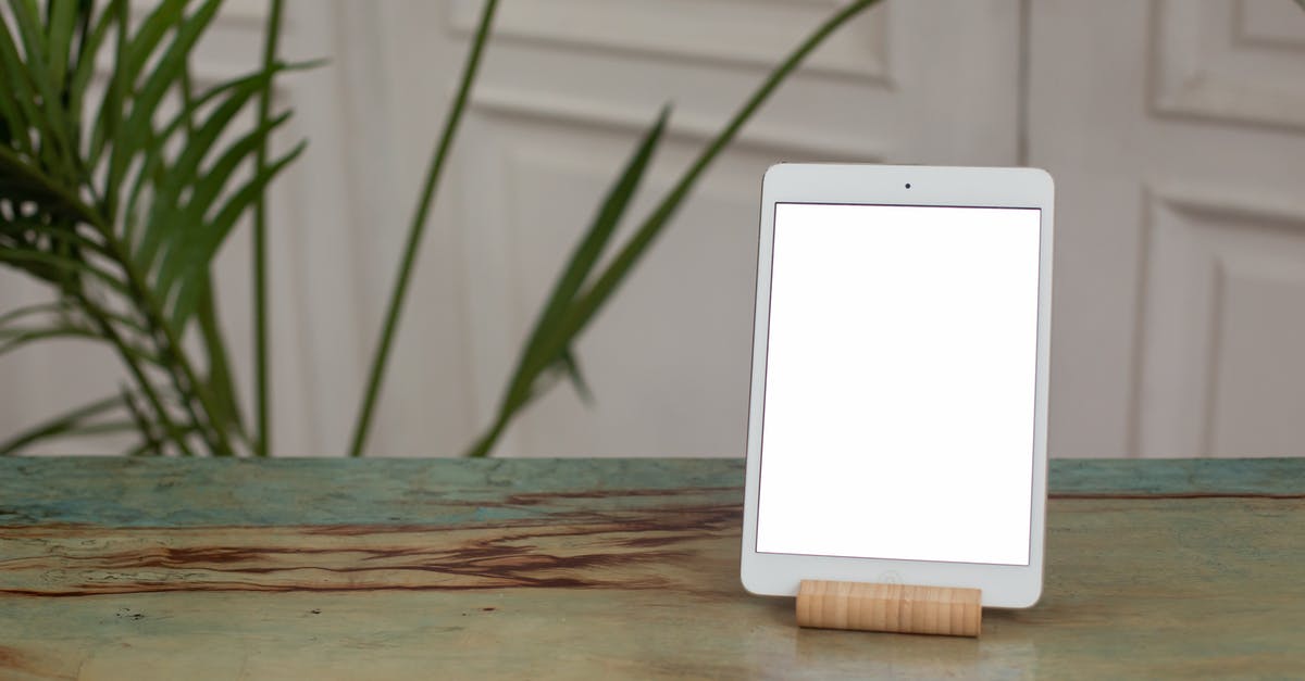 Autocrafting table in minecraft - White Tablet Computer on Brown Wooden Table