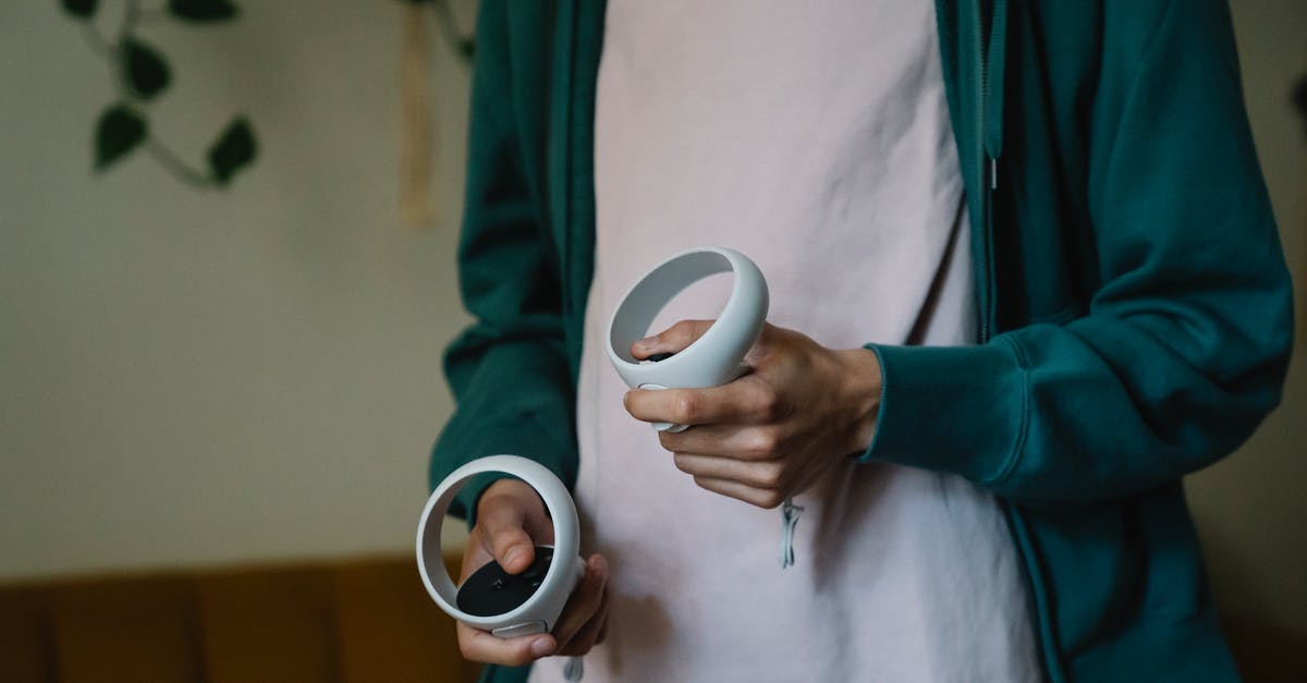 Autohotkey: How to map a keystroke to a controller button press - Unrecognizable gamer with VR controllers playing video game at home Autohotkey: How to map a keystroke to a controller button press - Unrecognizable gamer with VR controllers playing video game at home