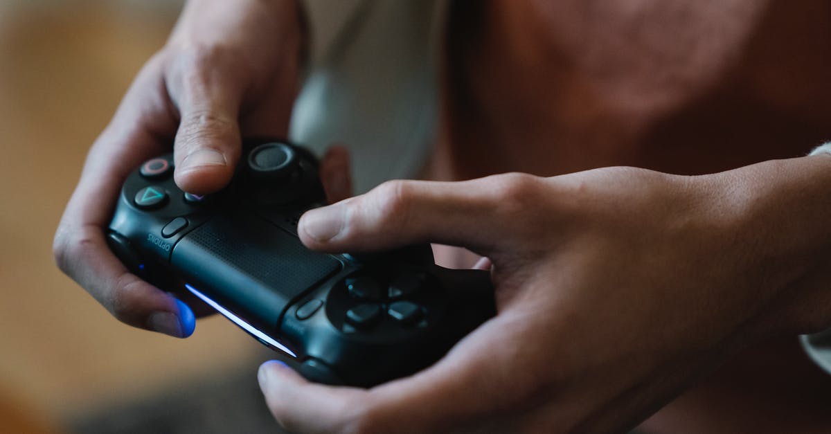 Autohotkey: How to map a keystroke to a controller button press - Crop gamer with joystick playing video game at home Autohotkey: How to map a keystroke to a controller button press - Crop gamer with joystick playing video game at home