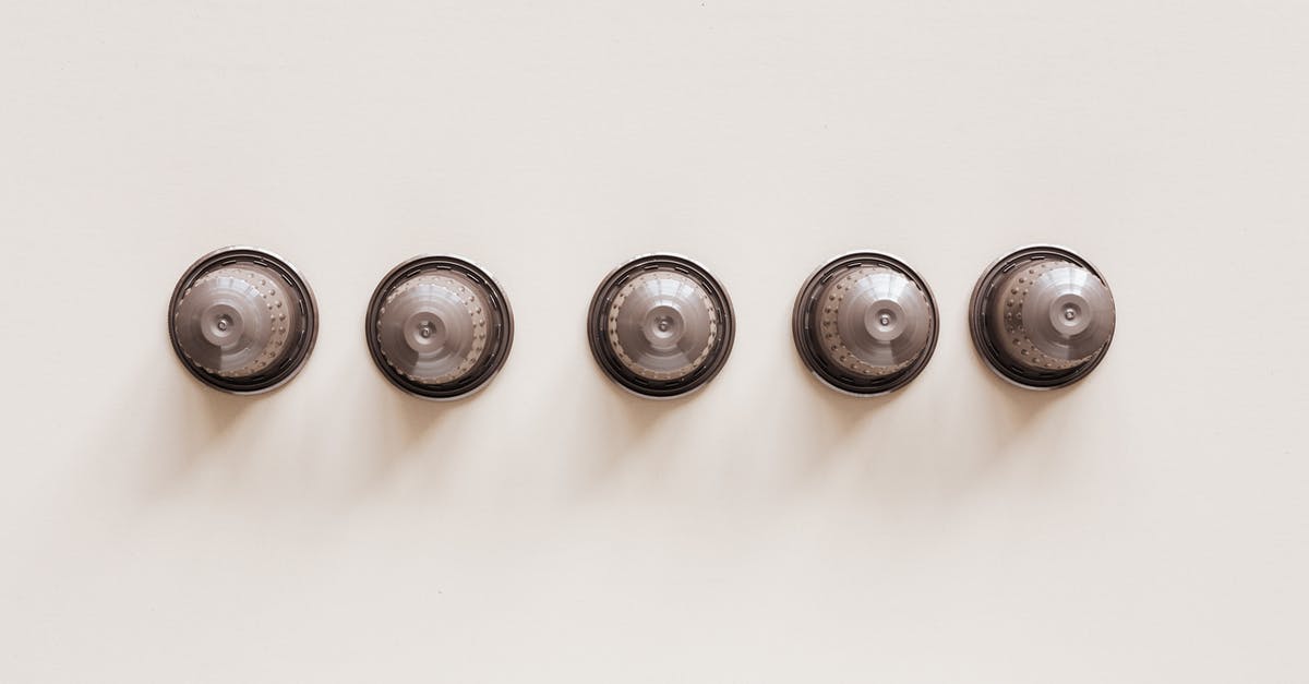 Avoid mobs from spawning automatically - Top view of coffee blends in disposable coffee capsules for espresso machine on white background.