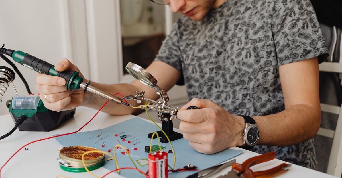 Battery saver mode does not work - A Man Using a Soldering Iron