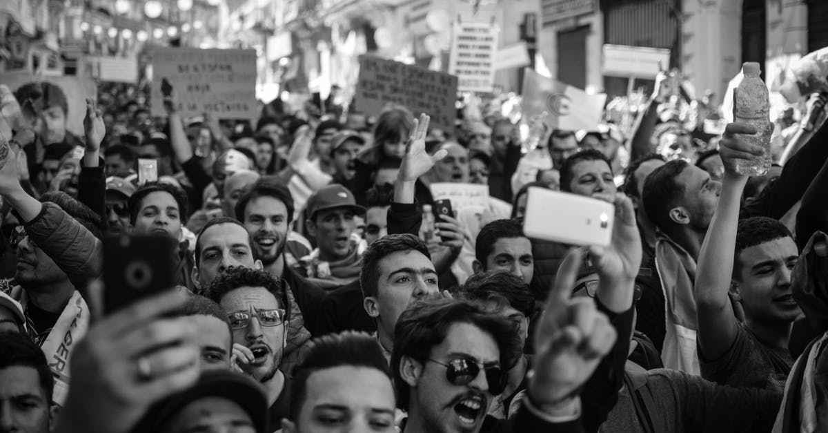 Battle my own Pokemon? [closed] - Crowd of People Black and White Photo
