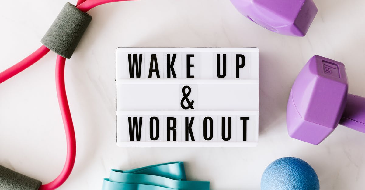Beast Ball supply - am I cheesing it? - Wake up and workout title on light box surface surrounded by colorful sport equipment