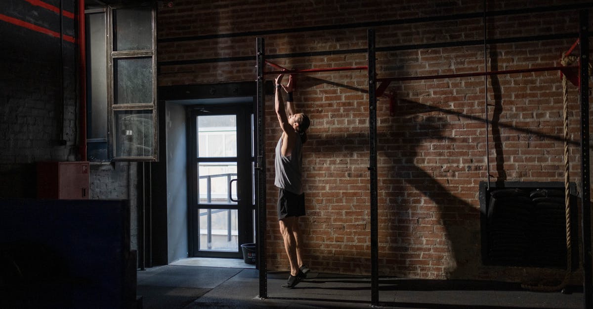 Being beaten to taking the gym back after lowering prestige - Man Doing Pull-Ups