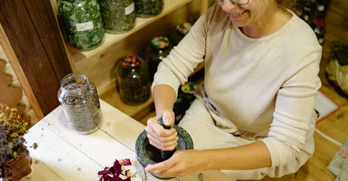 Best level grinding spot? - Woman in Beige Long Sleeve Shirt Holding Black and White Textile Best level grinding spot? - Woman in Beige Long Sleeve Shirt Holding Black and White Textile