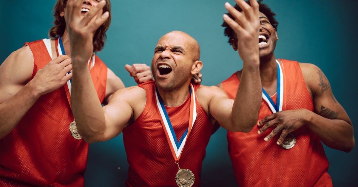Best strategy on buying champions and runes in LoL? - Overjoyed Men in Red Jerseys Wearing Their Medals