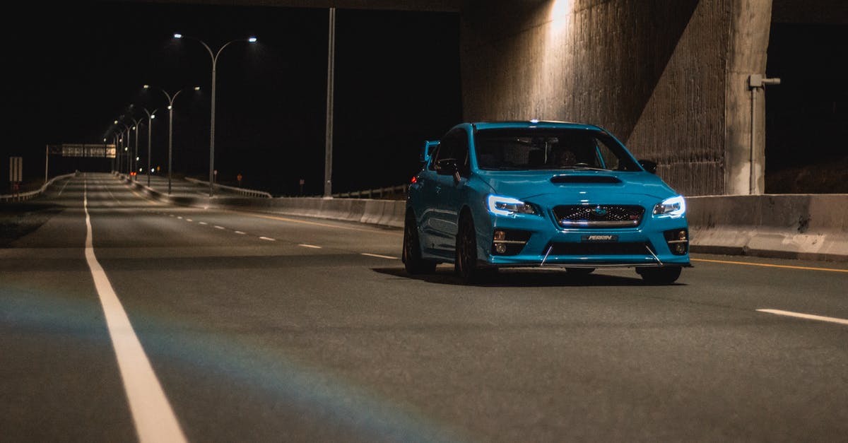 Best way to experience Halo MCC (Playing order) - Sports car riding on asphalt road along wall at night Best way to experience Halo MCC (Playing order) - Sports car riding on asphalt road along wall at night