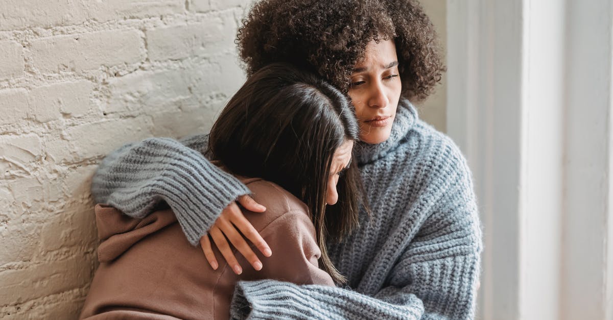 Best way to locate a friend in Elite: Dangerous (console) - Sad multiracial women hugging at home Best way to locate a friend in Elite: Dangerous (console) - Sad multiracial women hugging at home