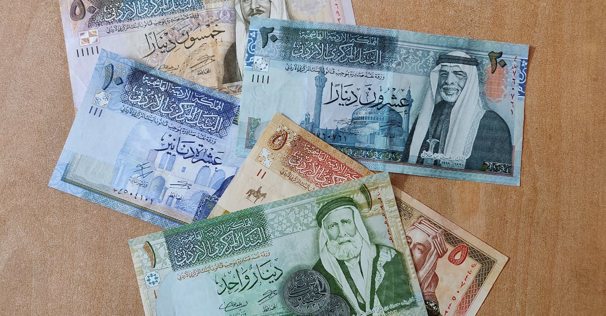 Better way to make money - 10 and 20 Banknotes on Brown Wooden Table Better way to make money - 10 and 20 Banknotes on Brown Wooden Table