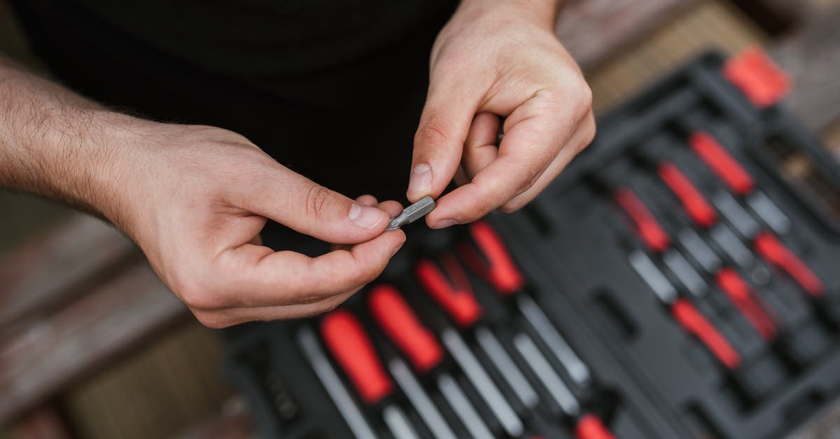 Big Bank Heist: Does 'the Beast' benefit from technician skills? - Faceless craftsman checking screw over tool box