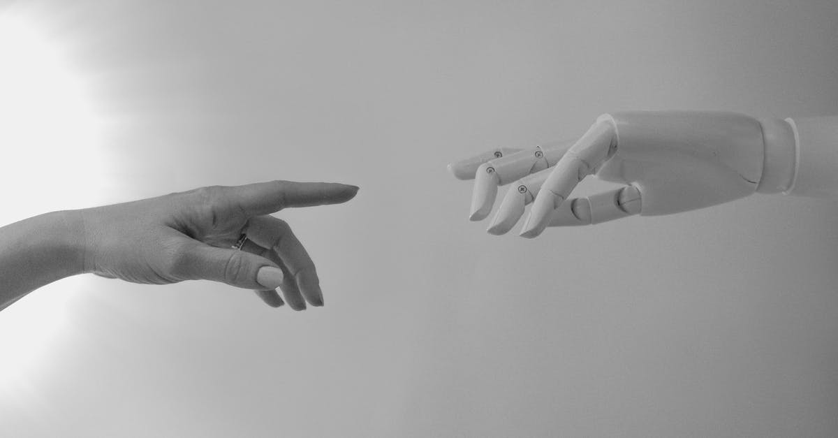 Black Box, AI and inhumanity - Black and White Photo of Human Hand and Robot Hand
