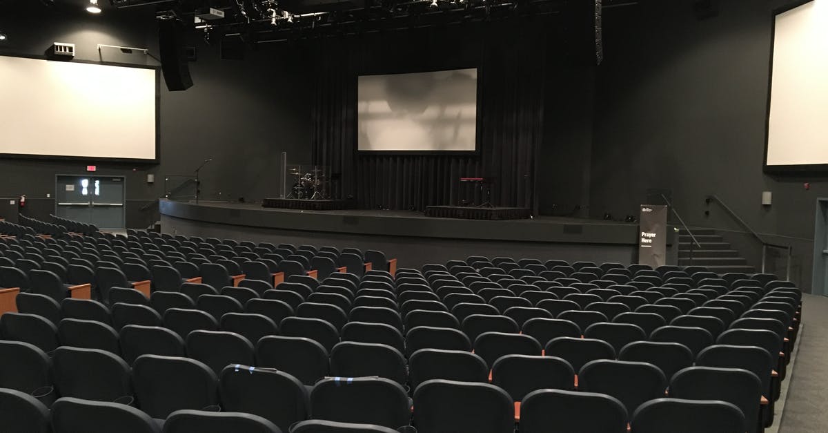 Black Ops II theater successfully render movie clips but doesn't upload it to YouTube - Rows of comfortable empty seats in modern theater hall with stage and screens