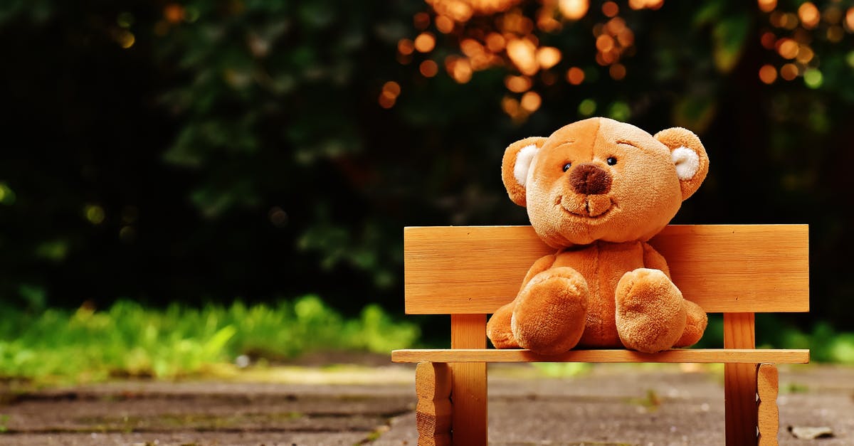 Borderlands 2: Uncle Teddy - Brown Teddy Bear on Brown Wooden Bench Outside Borderlands 2: Uncle Teddy - Brown Teddy Bear on Brown Wooden Bench Outside