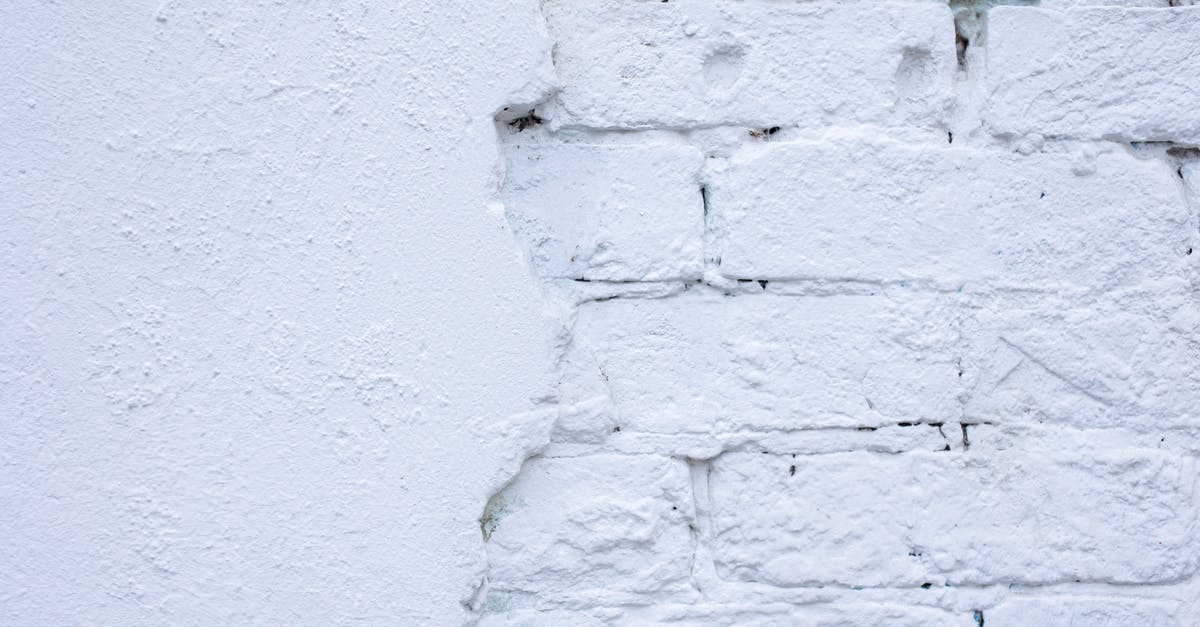 Broken Age, with Shay "breaking out" - Rough white wall of bricks and plaster Broken Age, with Shay "breaking out" - Rough white wall of bricks and plaster