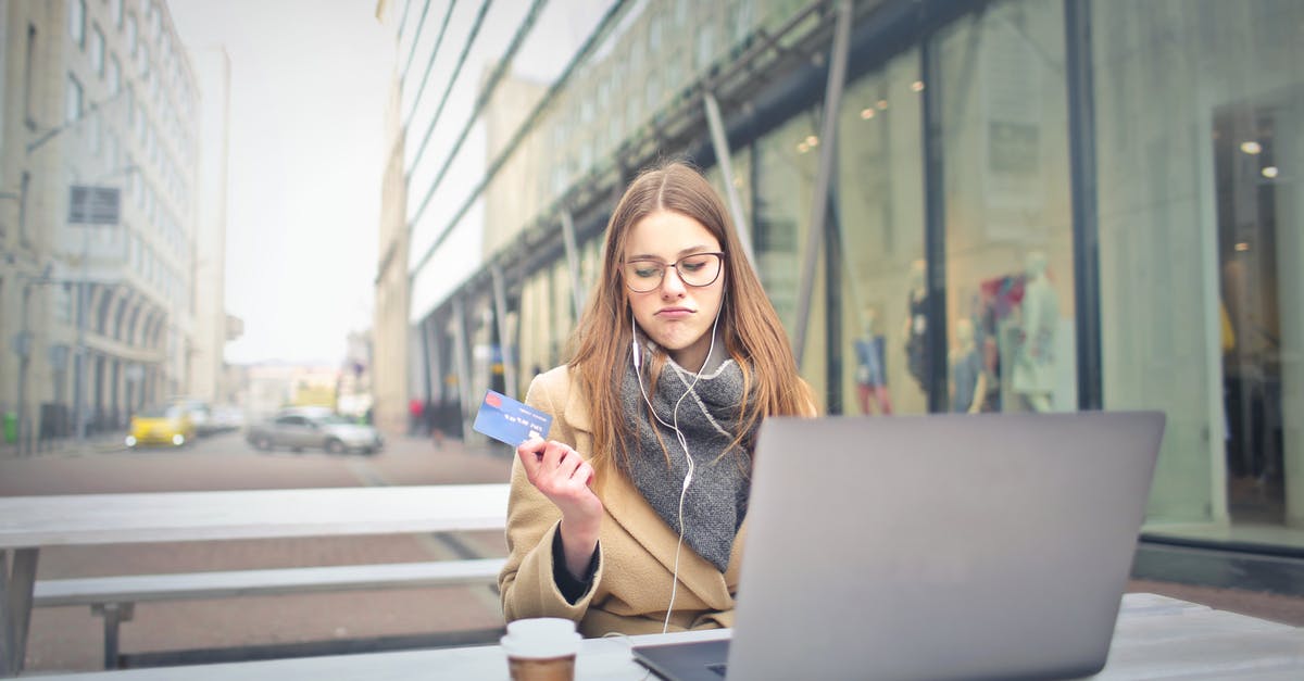 Bugged Pokémon Go sounds - Woman in Brown Coat Holding a Bank Card Bugged Pokémon Go sounds - Woman in Brown Coat Holding a Bank Card