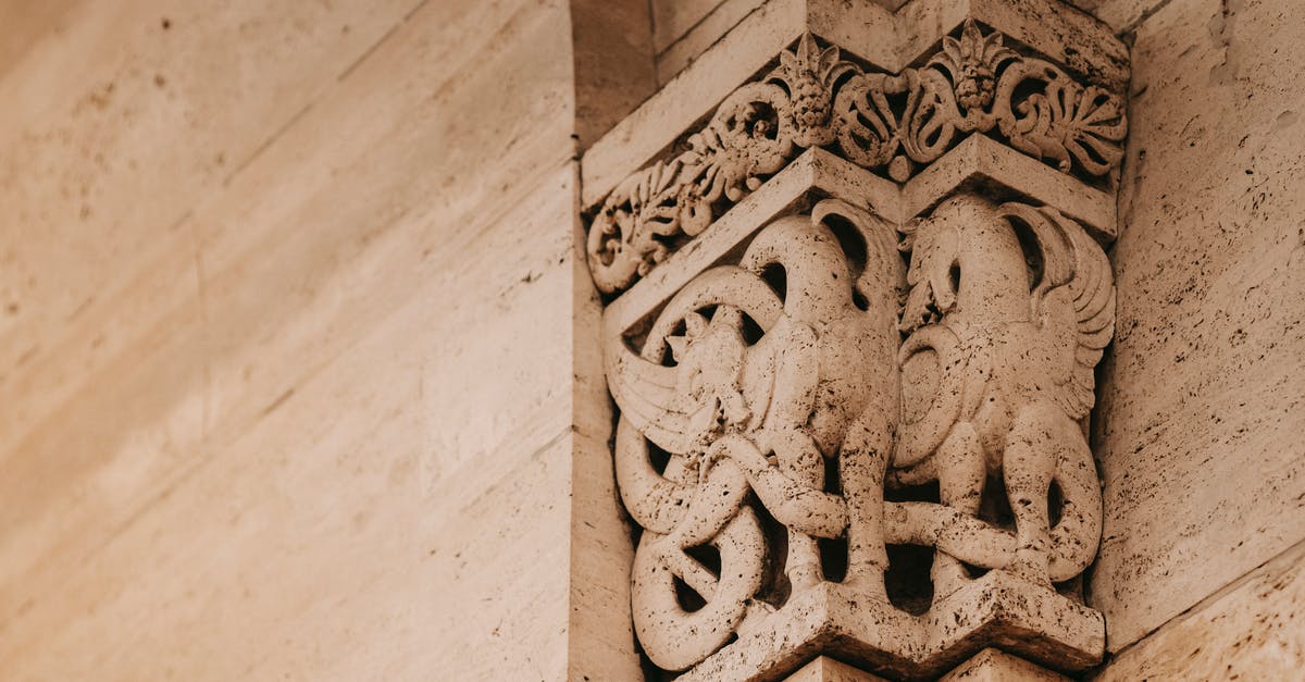 Building Mei's ice wall on top of another one - Interior of famous building with stone pilaster decorated with griffin Building Mei's ice wall on top of another one - Interior of famous building with stone pilaster decorated with griffin