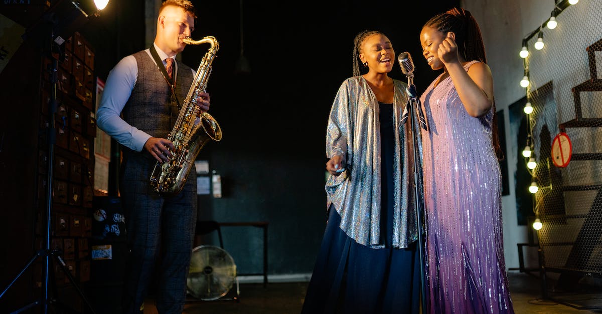 Bul Kathos's Wedding Band Effect - A Pair of Singers Singing with a Man Playing the Saxophone