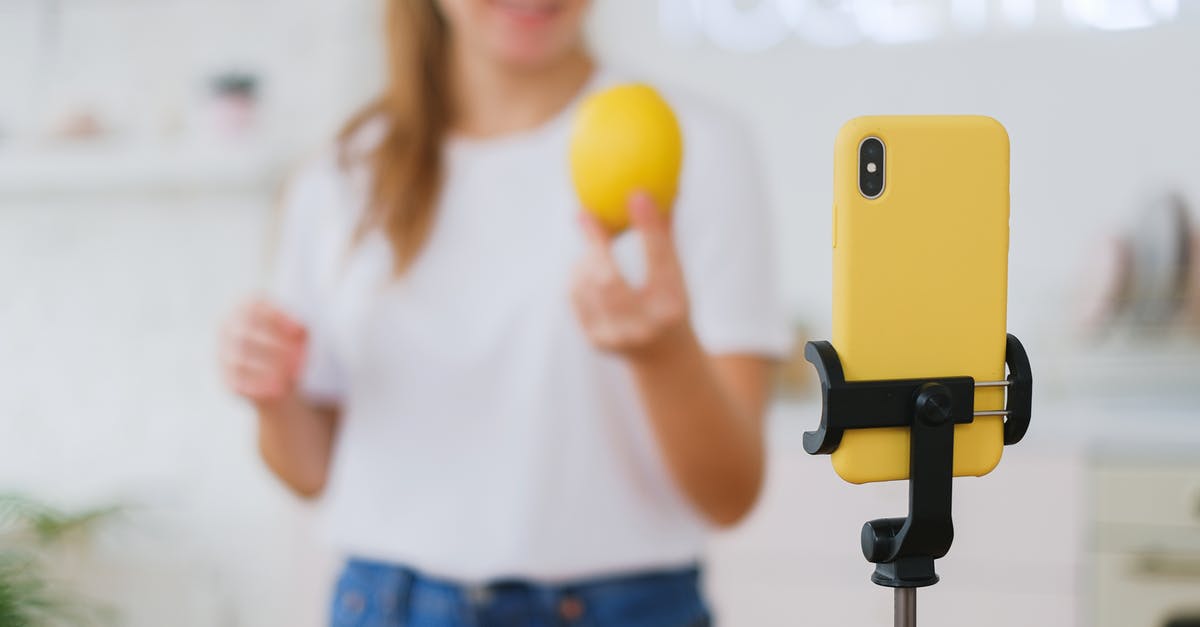Buying an additional Tango / Healing Salve during Tutorial Scenarios? - Woman Recording Herself with a Smartphone on a Tripod and Cooking 