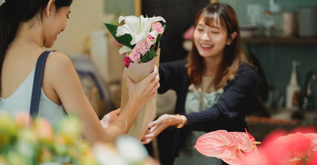 Buying Premium Pass in Just Dace 2017 also works for 2018 edition? - Happy Asian florist selling bouquet to female customer