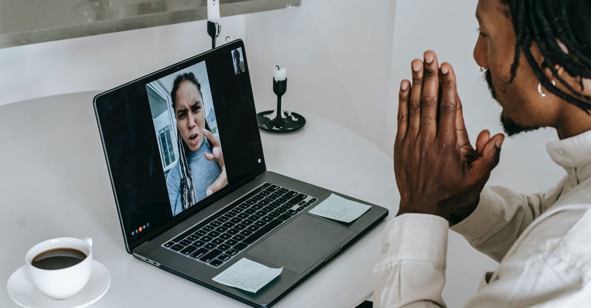 Call Of Duty 4 multiplayer issue - Anxious misunderstanding African American couple having video call via laptop and arguing emotionally while going through relationships crisis