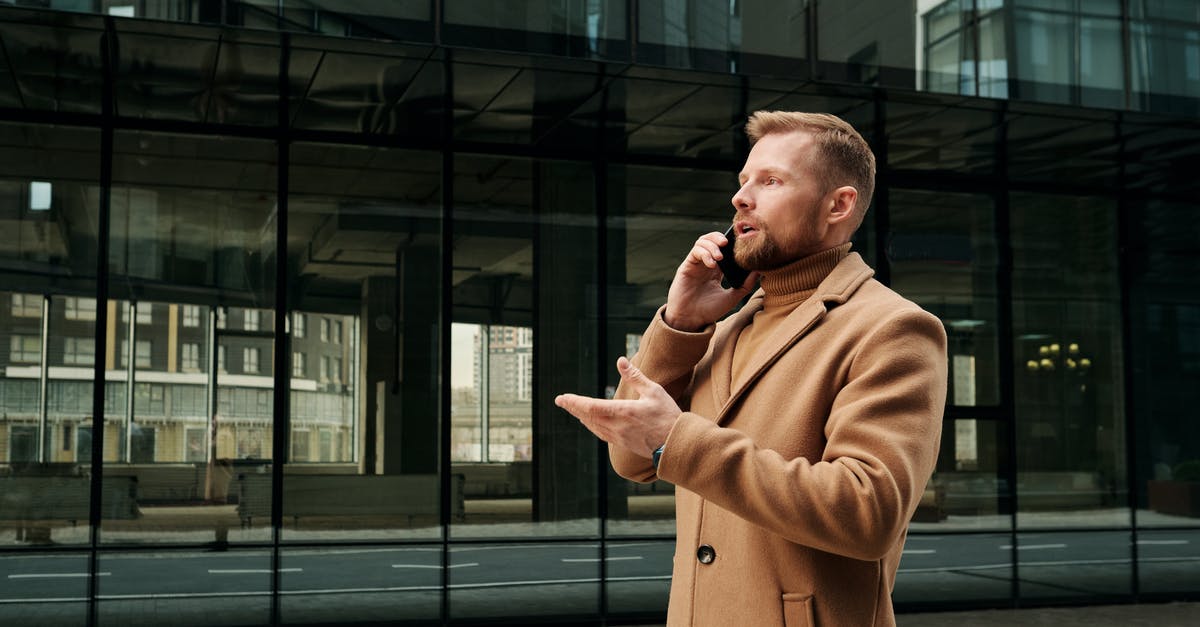 Call Of Duty 4 multiplayer issue - Man in Brown Coat Standing Near Glass Window Building