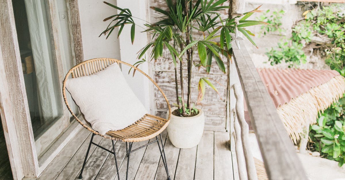 Can't buy lumber for my house [duplicate] - Potted plant and chair on balcony