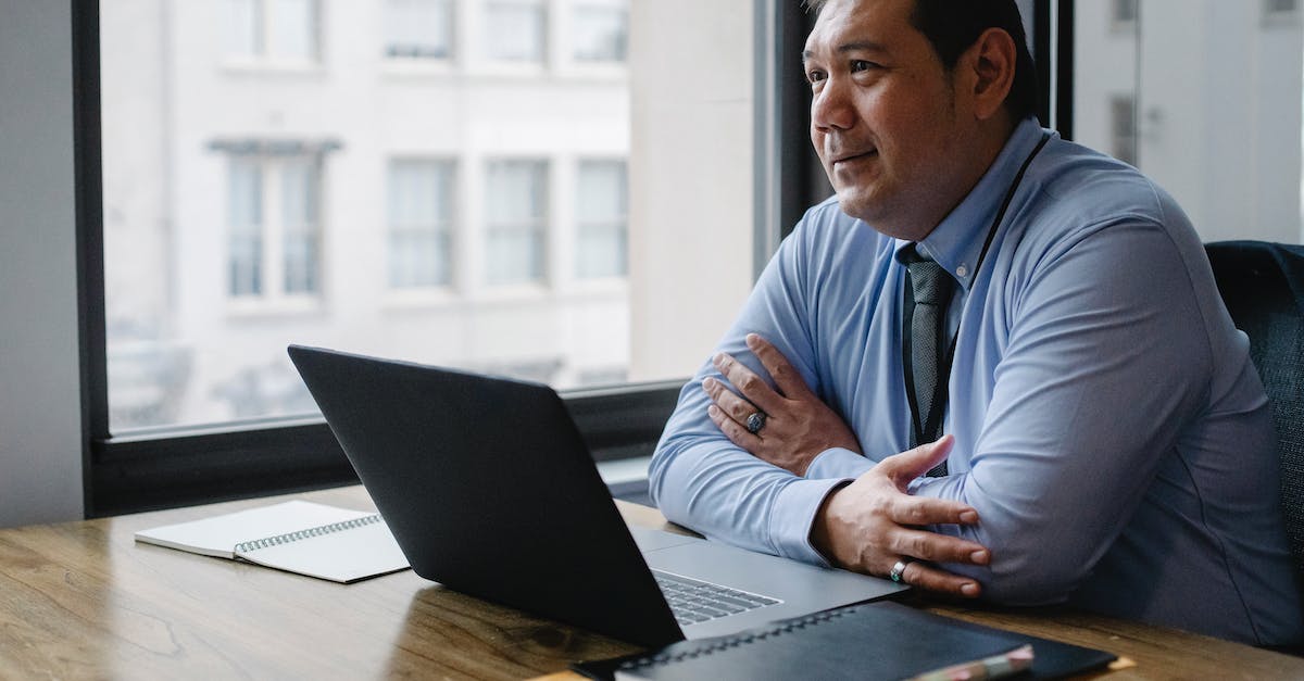 Can't connect to official cs:go servers due to packet loss - Adult successful ethnic male boss wearing shirt and tie sitting with hands crossed at workplace with documents and netbook