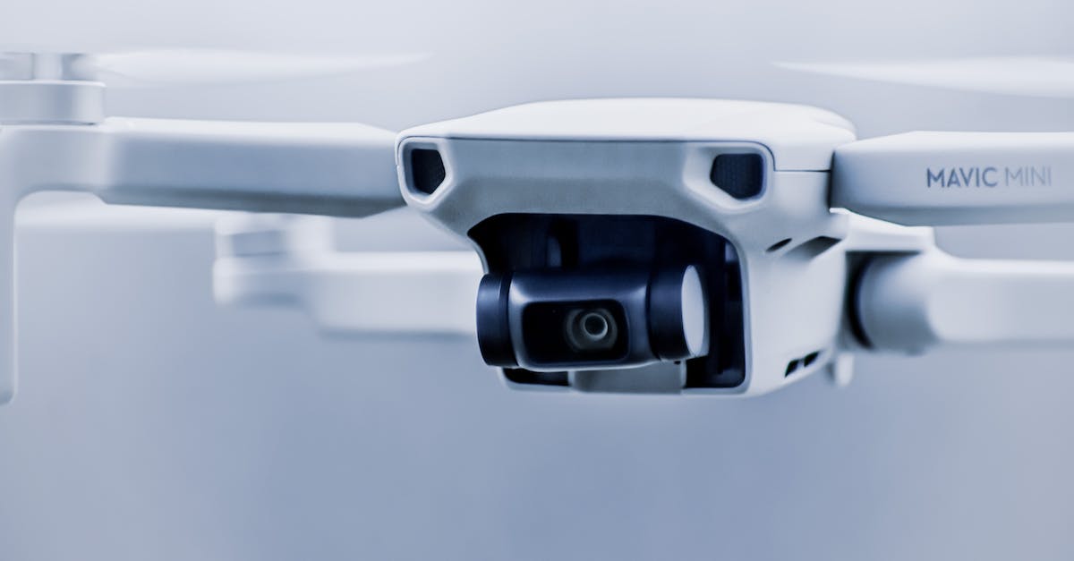 Can't control small probe launch - Small contemporary white drone with digital camera flying in light studio against blurred background Can't control small probe launch - Small contemporary white drone with digital camera flying in light studio against blurred background