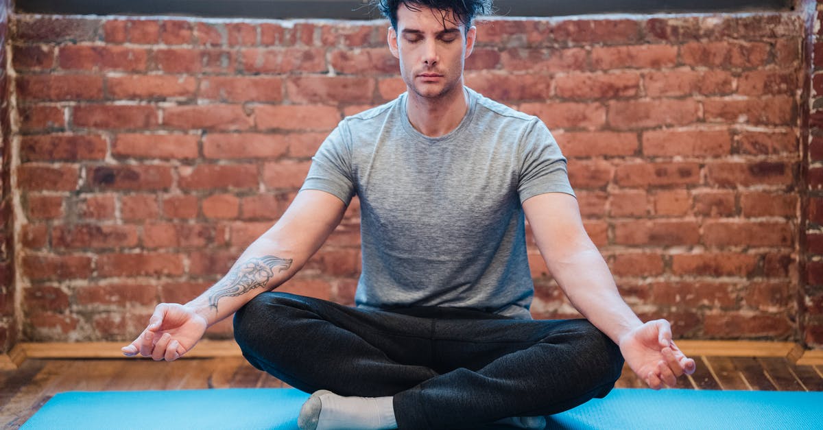 Can't execute easy fatalities in Mortal Mombat X - Man meditating in Easy Sit position on sports mat Can't execute easy fatalities in Mortal Mombat X - Man meditating in Easy Sit position on sports mat