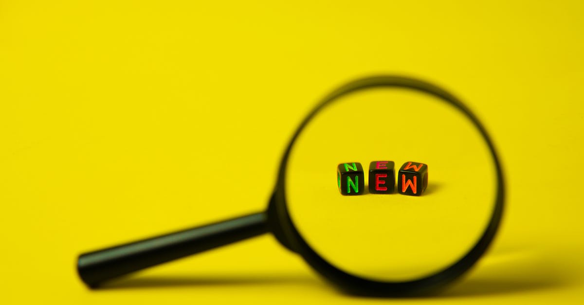 Can't find new DLC Not A Hero - Concept image of big black magnifier with word new in form of cubes against yellow background