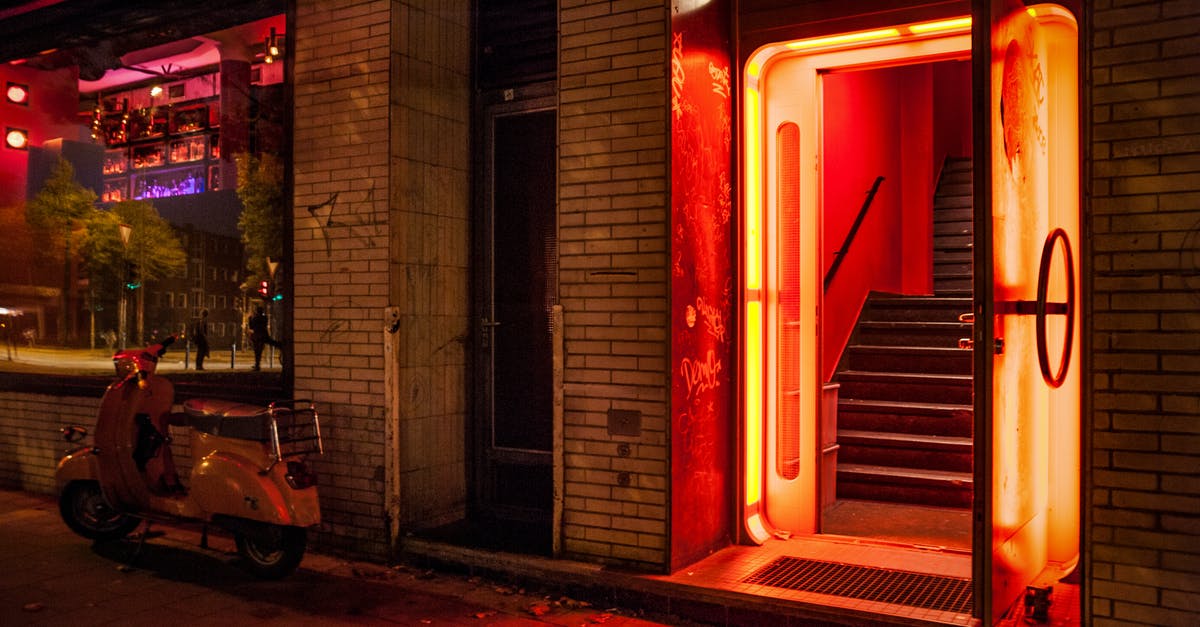 Can't find the red door at level 12 - White Motor Scooter Near Open Door Can't find the red door at level 12 - White Motor Scooter Near Open Door