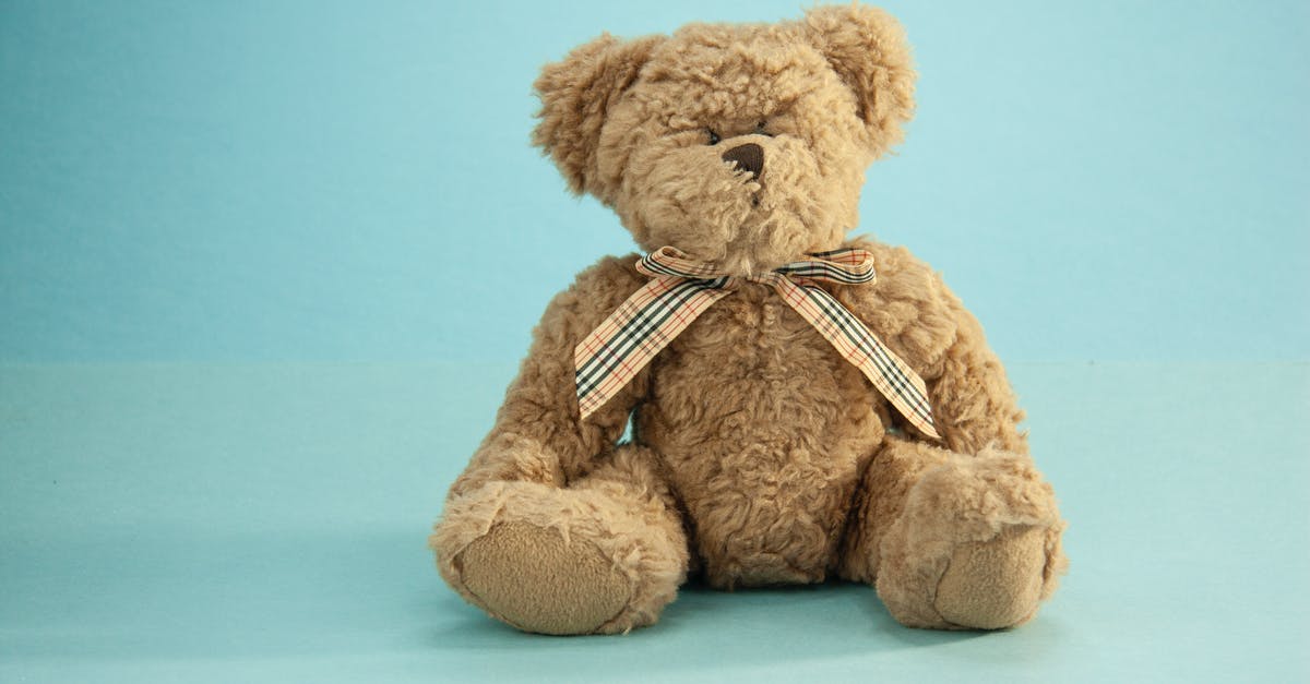 Can't gift a game to a friend through Battlenet app - Cute fluffy brown colored teddy bear with funny bow sitting on blue background