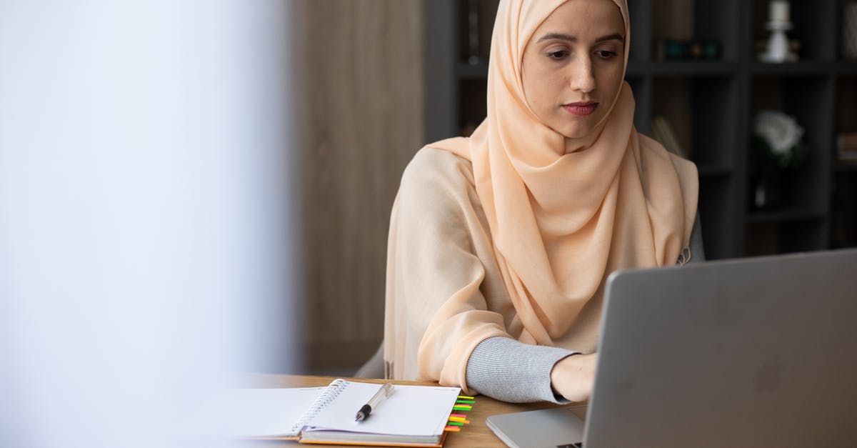 Can't make sense of launch window planner results - Focused young Muslim woman wearing elegant headscarf sitting at wooden table with planner and using modern laptop while working remotely Can't make sense of launch window planner results - Focused young Muslim woman wearing elegant headscarf sitting at wooden table with planner and using modern laptop while working remotely