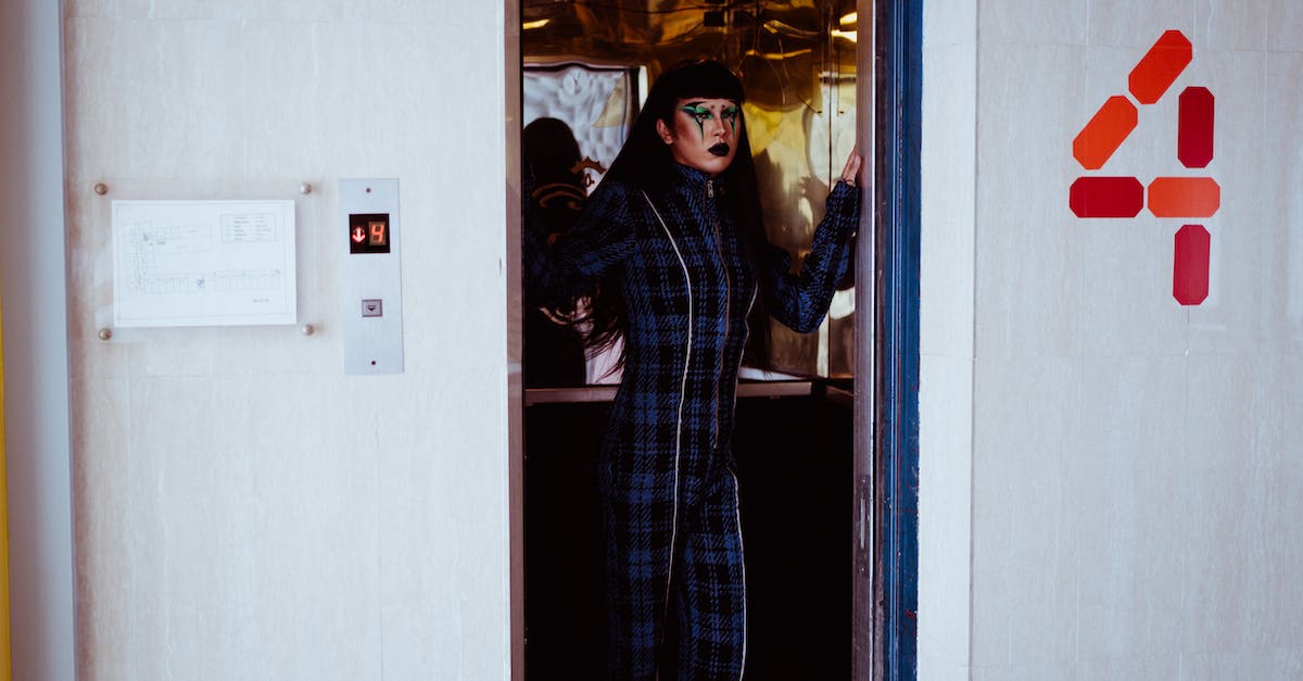 Can't open Great Lift Gate from Inside - Stylish woman standing in elevator